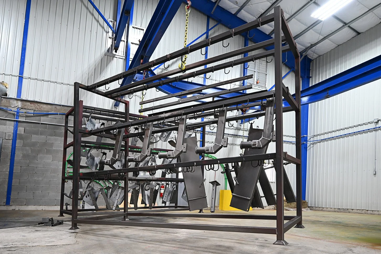 Large steel frame suspended inside the production facility