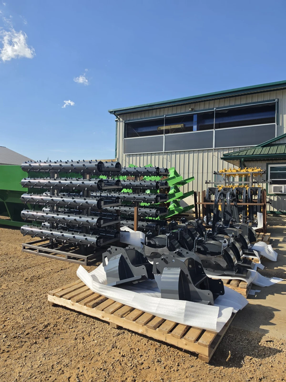 Industrial components staged on pallets outside the facility