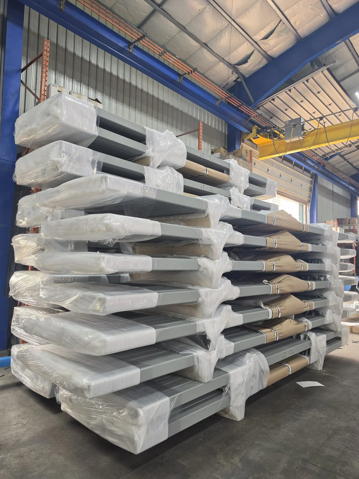 Wrapped finished components stacked for handling and shipping